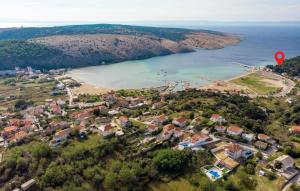 an aerial view of a small town next to a body of water at 2 Bedroom Beautiful Apartment In Lopar in Lopar