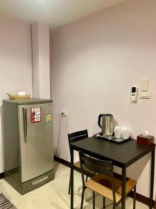 Kuchyň nebo kuchyňský kout v ubytování Sampheng Apartment