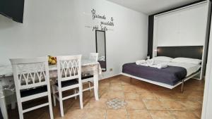 a bedroom with two bunk beds and a desk at Da Nenè in Cefalù