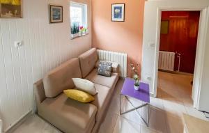a living room with a couch and a table at Stunning Apartment In Supetar With Wifi in Supetar