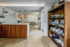 a kitchen with a sink and a counter with plates at Juliette V4 P in Oostduinkerke
