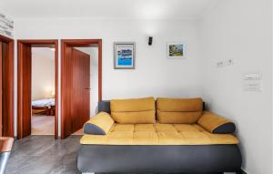 a living room with a couch in a room at 4 Bedroom Stunning Home In Vodice in Vodice +21 photos
