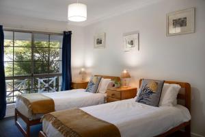 Katil atau katil-katil dalam bilik di Springview Cottage- captivating bush retreat