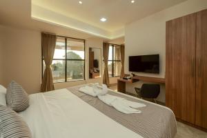 Hotel Shoolin Comforts客房内的一张或多张床位