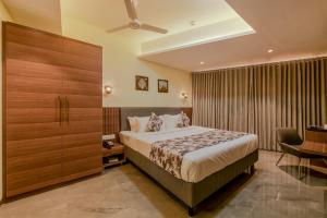 Hotel Shoolin Comforts客房内的一张或多张床位