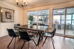 a dining room with a table and chairs at Georgian Bay 3-bdrm lakefront Main House in Dillon