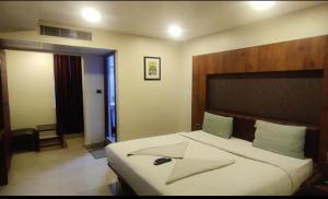 Postel nebo postele na pokoji v ubytování Hotel Adya Classsic