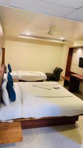 Postel nebo postele na pokoji v ubytování Hotel Adya Classsic