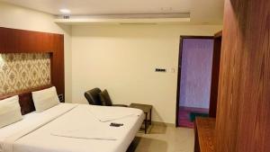 Postel nebo postele na pokoji v ubytování Hotel Adya Classsic