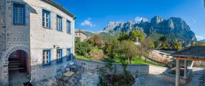 a building with a view of the mountains at Papigo Villas in Papigko