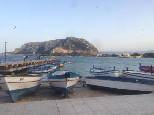 a group of boats parked on the shore of a body of water at Casetta Mondello in Mondello