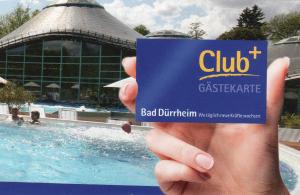 a hand holding a card with a swimming pool at LebensART in Bad Dürrheim
