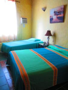 Posteľ alebo postele v izbe v ubytovaní Hotel Vereda Tropical