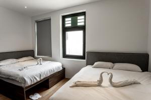 Postel nebo postele na pokoji v ubytování Earnest Hotel Georgetown
