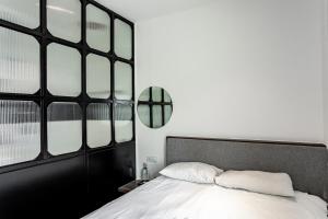 Postel nebo postele na pokoji v ubytování Earnest Hotel Georgetown