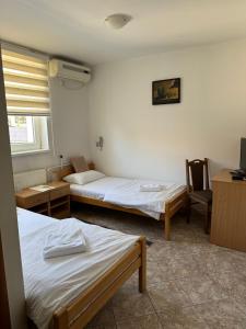Postel nebo postele na pokoji v ubytování Hotel Višegrad