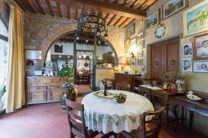 a kitchen and dining room with a table and chairs at La Fattoressa in Florence