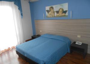 Postel nebo postele na pokoji v ubytování Hotel Lory My Wellness SPA