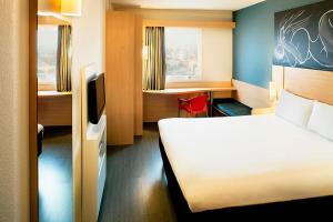 Ein Bett oder Betten in einem Zimmer der Unterkunft ibis Macae