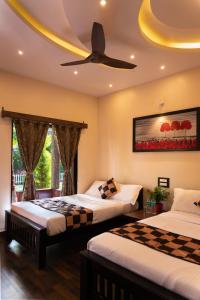 Ένα ή περισσότερα κρεβάτια σε δωμάτιο στο River Point Dandeli