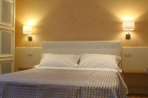 Posteľ alebo postele v izbe v ubytovaní B&B I Propilei di San Girolamo