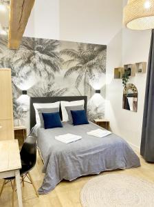 Ένα ή περισσότερα κρεβάτια σε δωμάτιο στο Grand gite & petit gite +65 φωτογραφίες