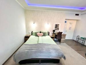 Postel nebo postele na pokoji v ubytování Belien Apartman