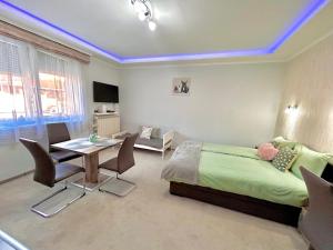 TV a/nebo společenská místnost v ubytování Belien Apartman