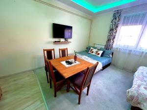 TV a/nebo společenská místnost v ubytování Belien Apartman