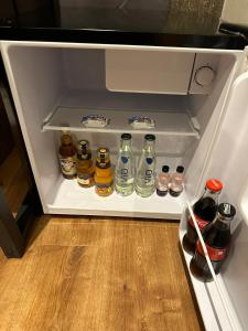 an open refrigerator filled with lots of bottles of alcohol at Relax in Duisburg