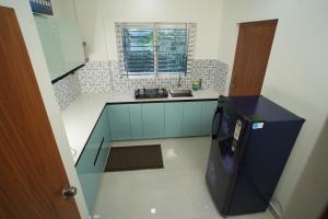 Kuchyň nebo kuchyňský kout v ubytování Theeram Residency