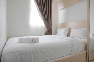 Postel nebo postele na pokoji v ubytování Comfort and Warm 2BR at Parkland Avenue Apartment By Travelio