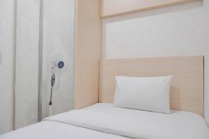 Postel nebo postele na pokoji v ubytování Comfort and Warm 2BR at Parkland Avenue Apartment By Travelio