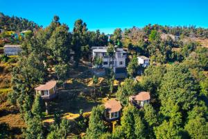 an aerial view of a large house in the trees at Treecasa Resort in Sunāri