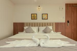 Hotel Shoolin Comforts客房内的一张或多张床位