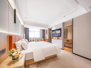 Vuode tai vuoteita majoituspaikassa Yiwu Yunjing Hotel