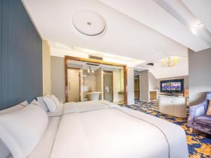 Vuode tai vuoteita majoituspaikassa Yiwu Yunjing Hotel