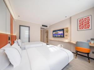 Vuode tai vuoteita majoituspaikassa Yiwu Yunjing Hotel
