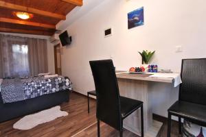 TV a/nebo společenská místnost v ubytování Apartment Tomi