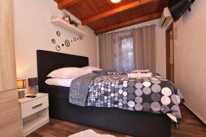 Postel nebo postele na pokoji v ubytování Apartment Tomi