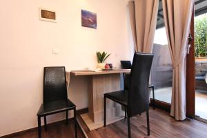 TV a/nebo společenská místnost v ubytování Apartment Tomi