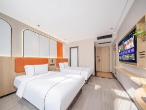 Vuode tai vuoteita majoituspaikassa Yiwu Yunjing Hotel