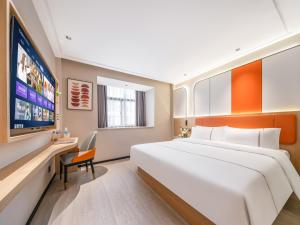 Vuode tai vuoteita majoituspaikassa Yiwu Yunjing Hotel