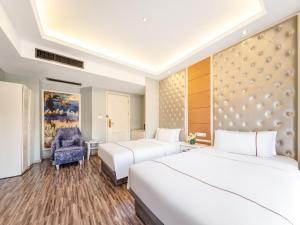 Vuode tai vuoteita majoituspaikassa Yiwu Yunjing Hotel