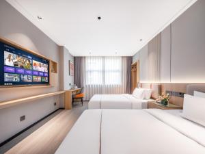 Vuode tai vuoteita majoituspaikassa Yiwu Yunjing Hotel