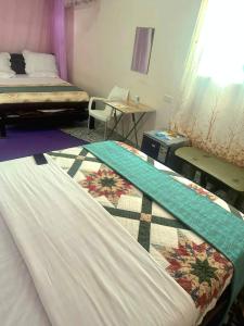 Postel nebo postele na pokoji v ubytování Vienna Hotel Kasese