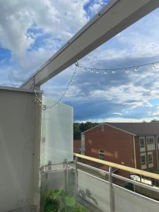 a balcony with a view of a building at A two-story apartment with three bedrooms in Trondheim