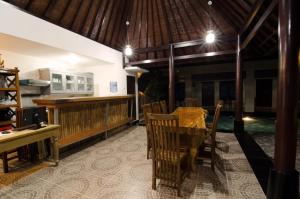 a dining room with a table and chairs at Sanur Guest House in Sanur