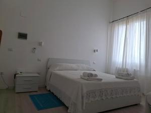 Postel nebo postele na pokoji v ubytování Hotel Moderno