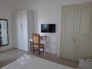 TV a/nebo společenská místnost v ubytování Hotel Moderno